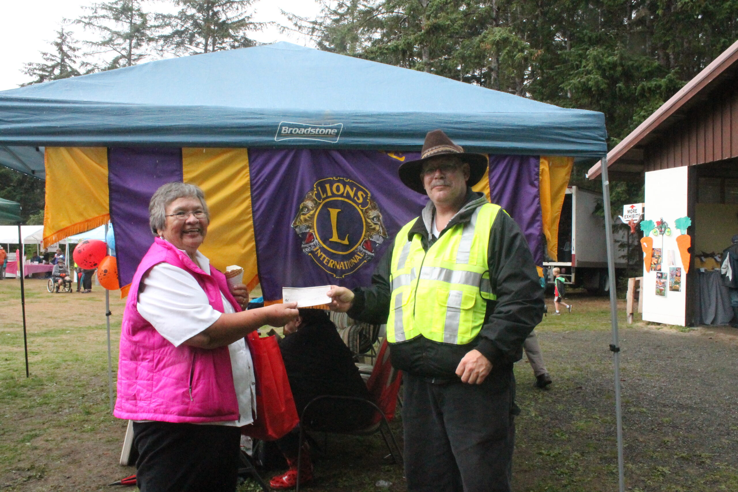 Lions raffle draw winner presented by Fall Fair President and Lions member to Mrs. Russ