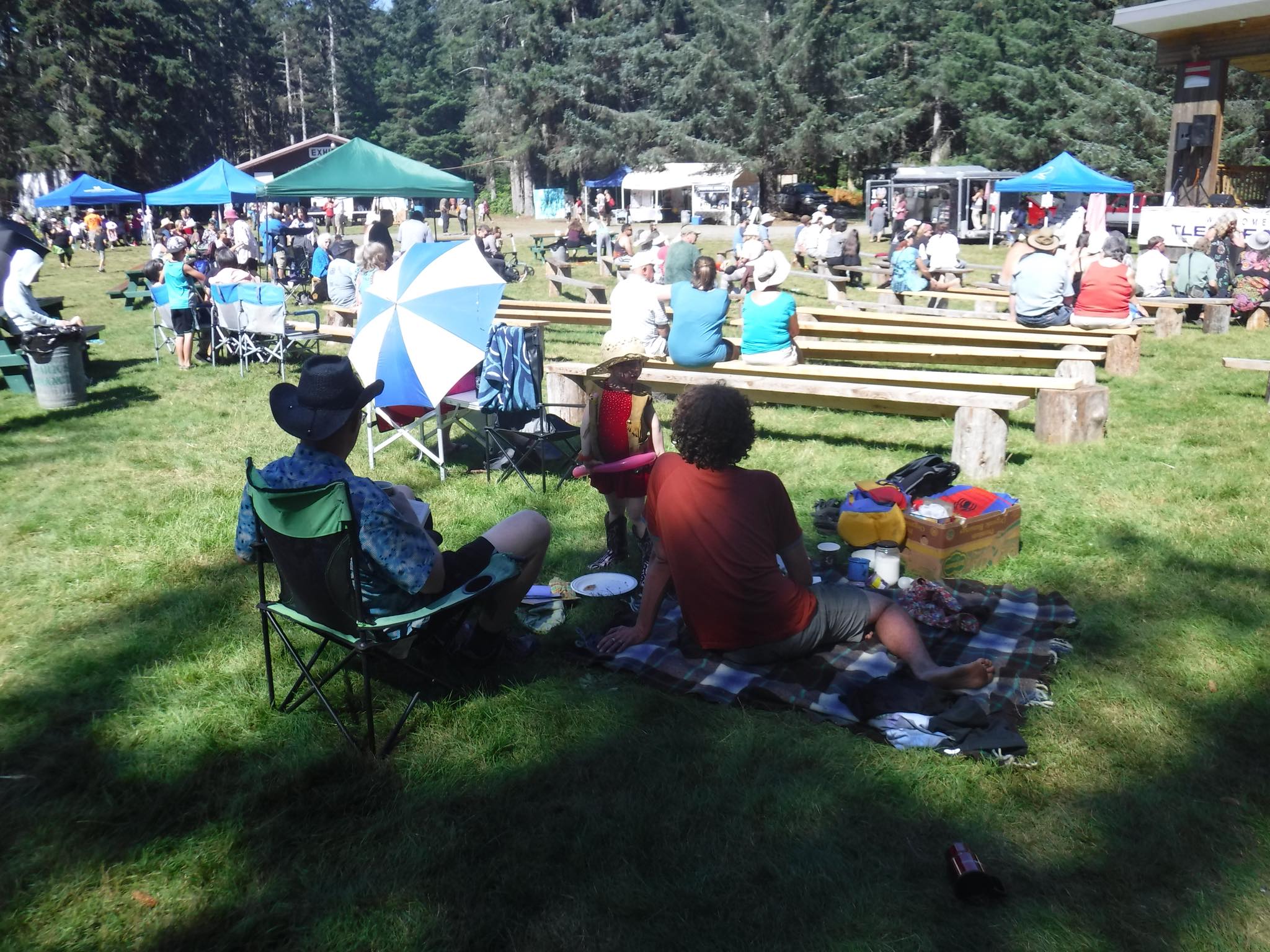 People gathered in the shade at the Tlell Fall Fair